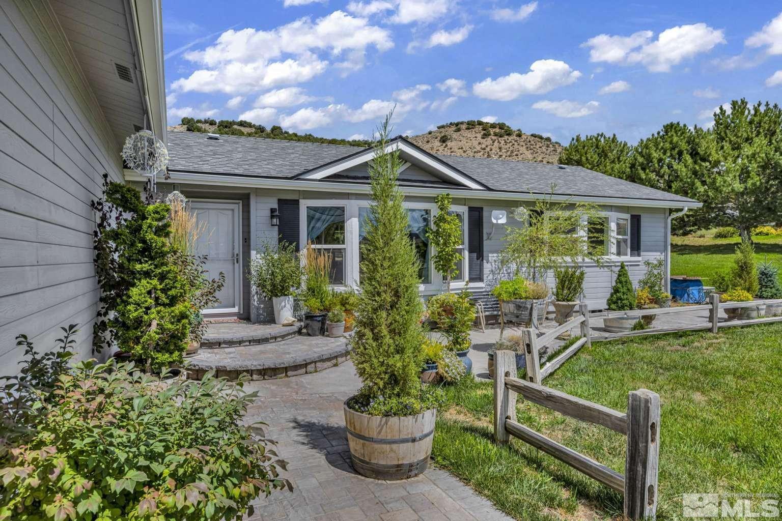 160-180 Quarter Horse Circle Reno, NV 89508 - Photo 5 of 23 a front view of a house with a garden