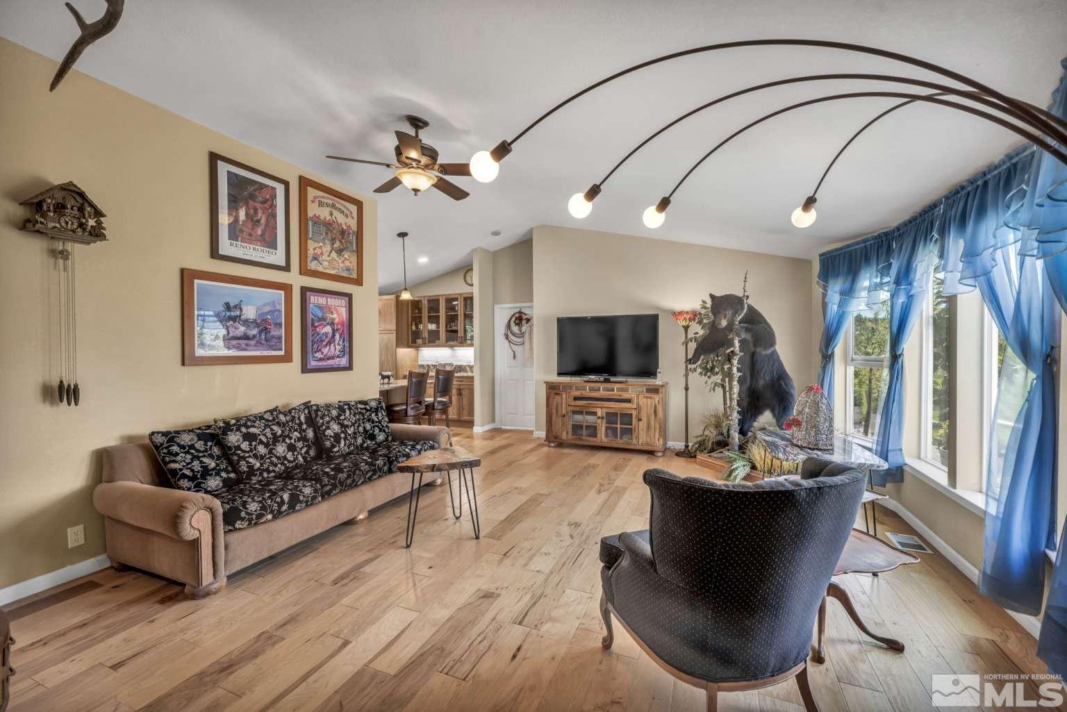 160-180 Quarter Horse Circle Reno, NV 89508 - Photo 6 of 23 a living room with furniture a flat screen tv and a large window