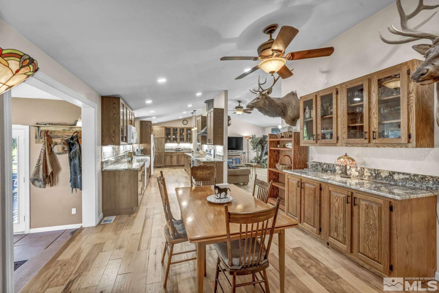 160-180 Quarter Horse Circle Reno, NV 89508 - Photo 7 of 23 a view of a dining room with furniture and chandelier