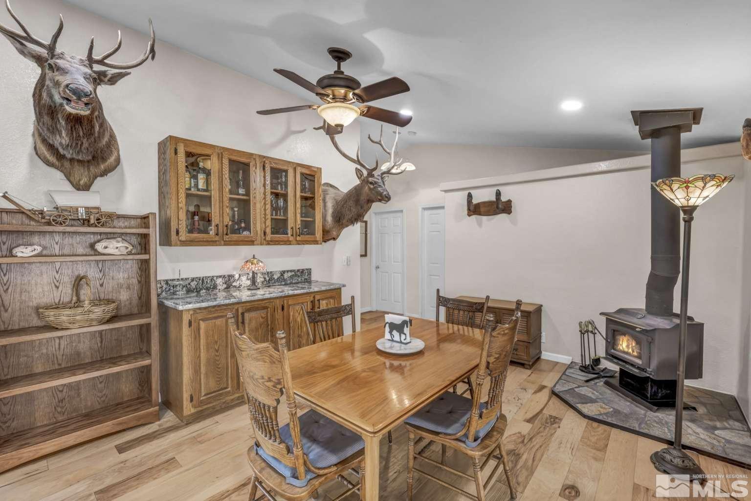 160-180 Quarter Horse Circle Reno, NV 89508 - Photo 9 of 23 a dining room with furniture and wooden floor