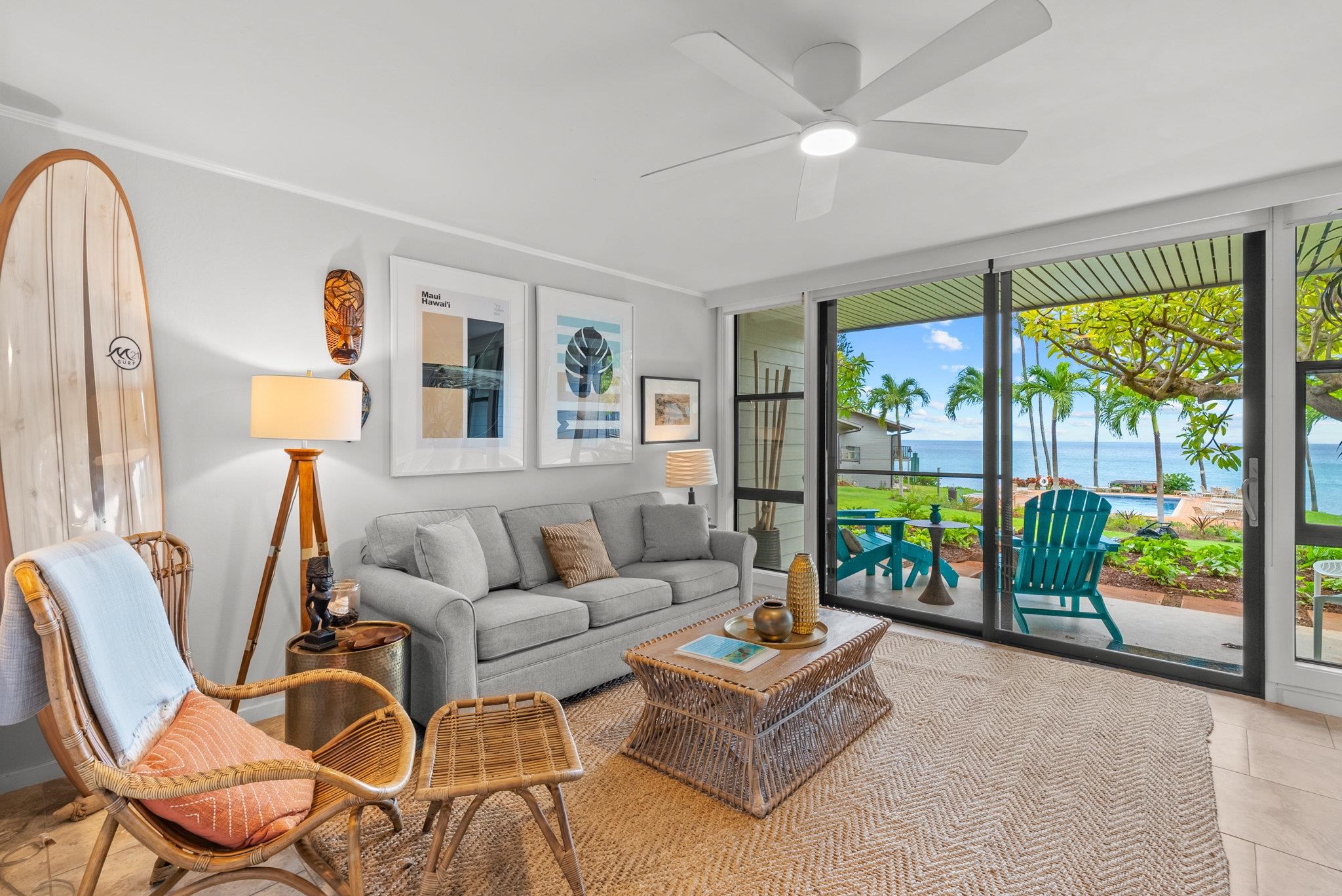 a living room with fireplace furniture and a floor to ceiling window