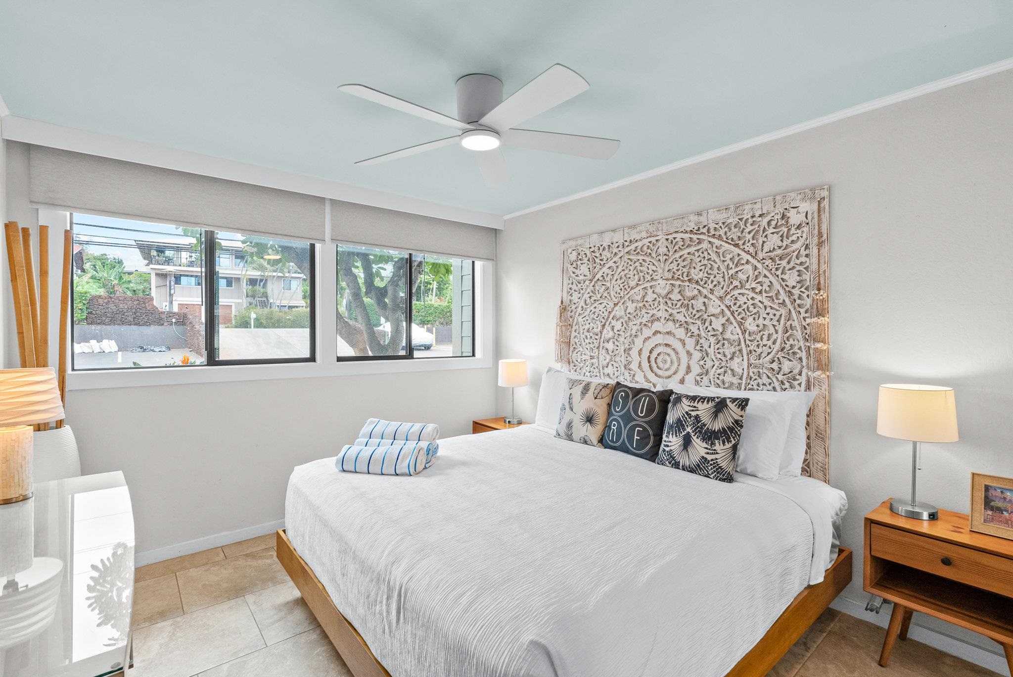 4057 Lower Honoapiilani Road, Unit 114 Lahaina, HI 96761 - Photo 15 of 23 a bedroom with a bed and window