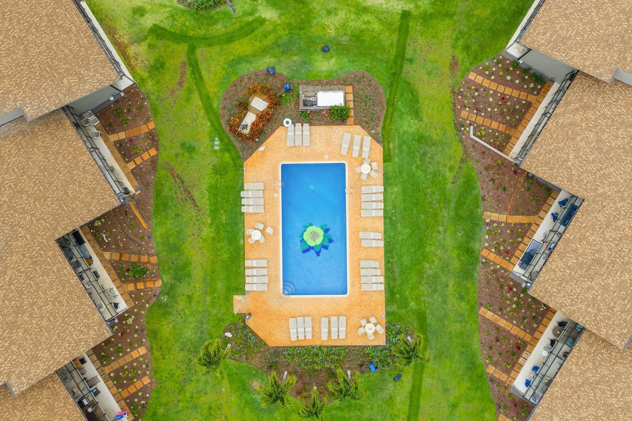 4057 Lower Honoapiilani Road, Unit 114 Lahaina, HI 96761 - Photo 19 of 23 an aerial view of a house with a yard and wooden floor