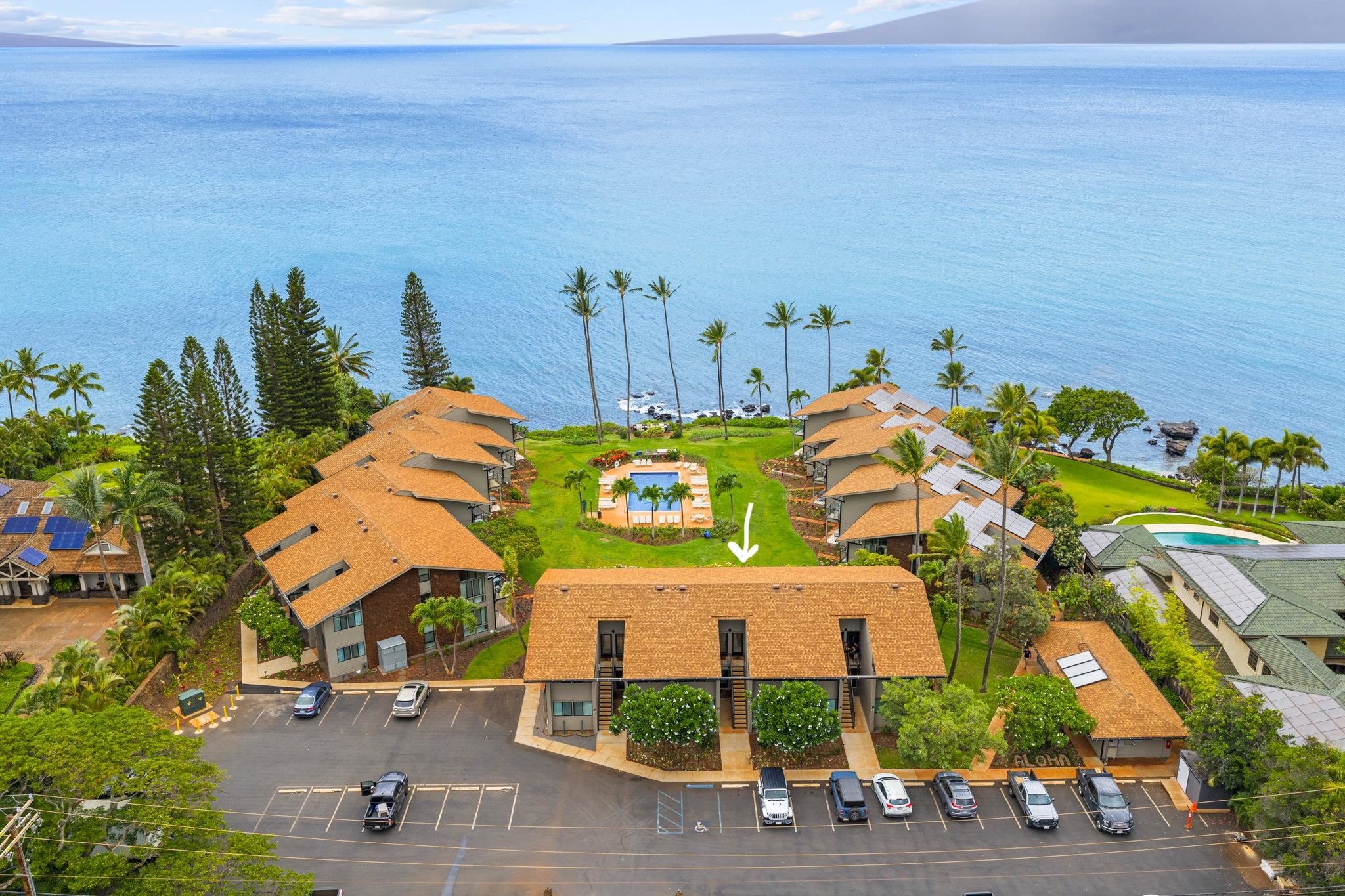 4057 Lower Honoapiilani Road, Unit 114 Lahaina, HI 96761 - Photo 21 of 23 an aerial view of multiple house with outdoor space