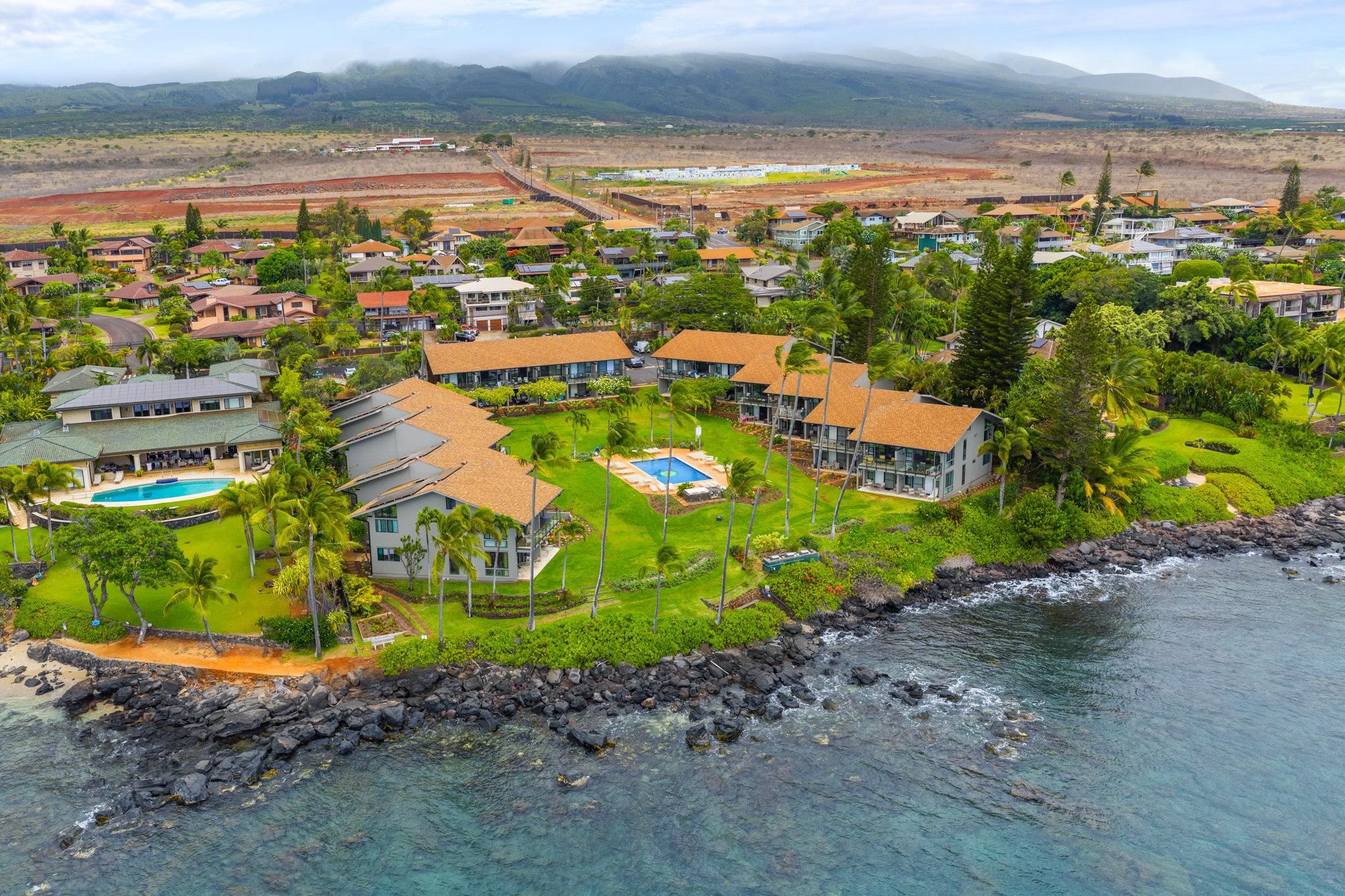 4057 Lower Honoapiilani Road, Unit 114 Lahaina, HI 96761 - Photo 22 of 23 an aerial view of multiple house