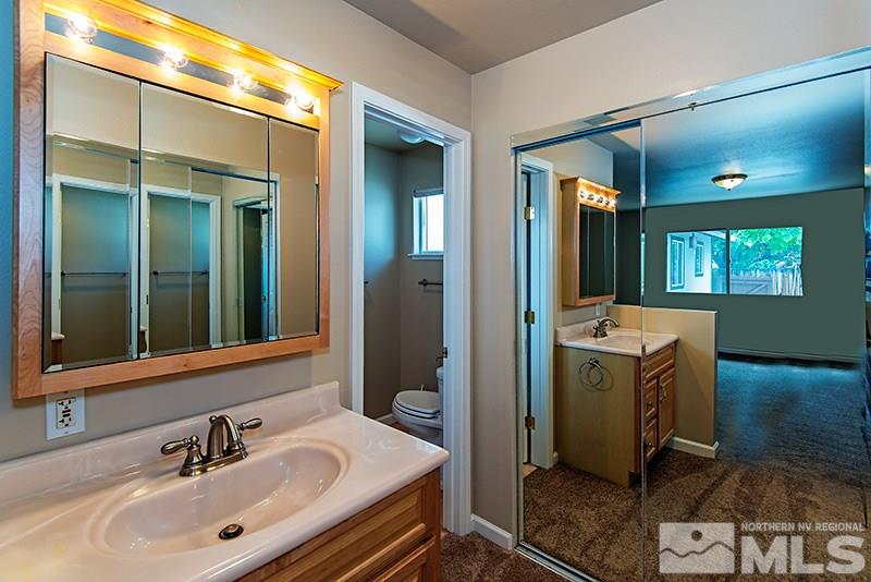 2750 Judith Lane Reno, NV 89503 - Photo 8 of 15 a bathroom with a sink and mirror