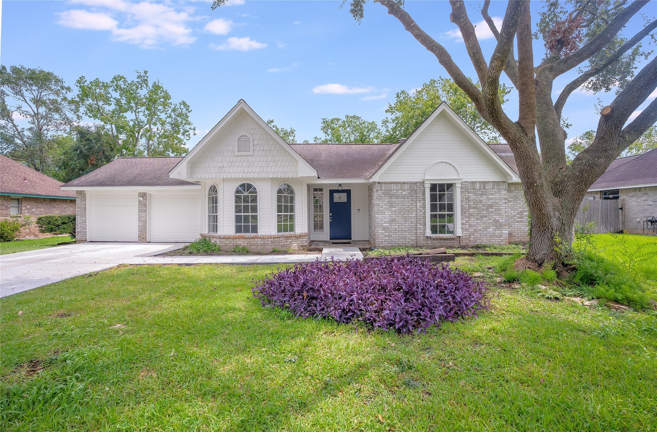a front view of a house with a garden