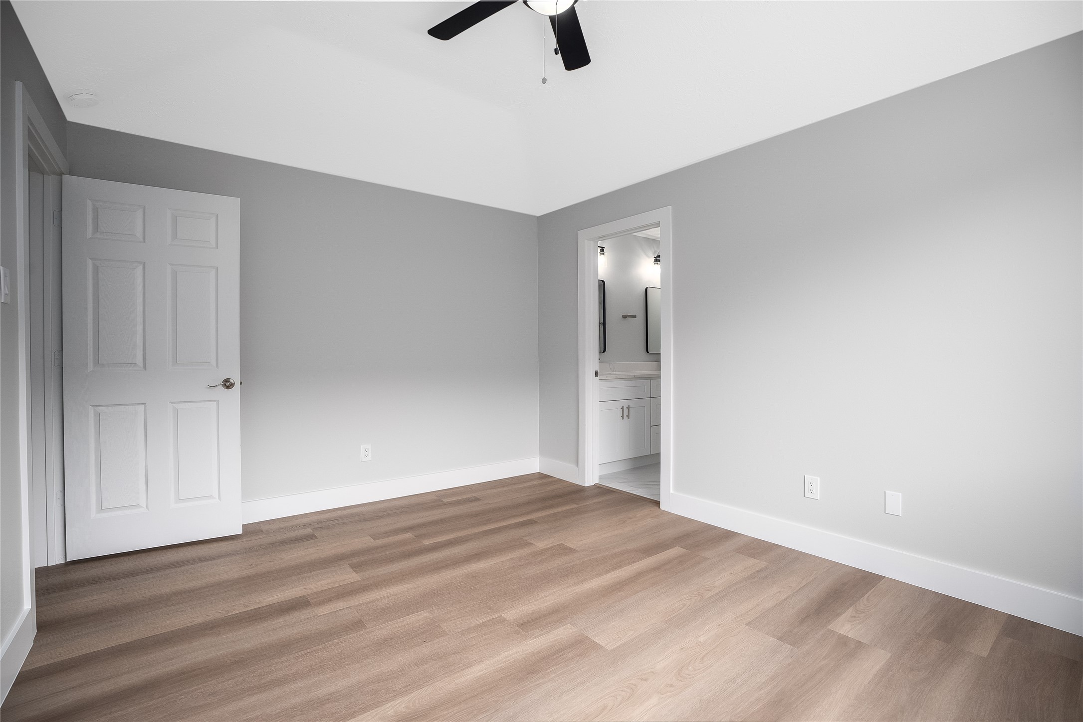 1406 Kent Way Friendswood, TX 77546 - Photo 16 of 31 a view of an empty room with wooden floor and windows