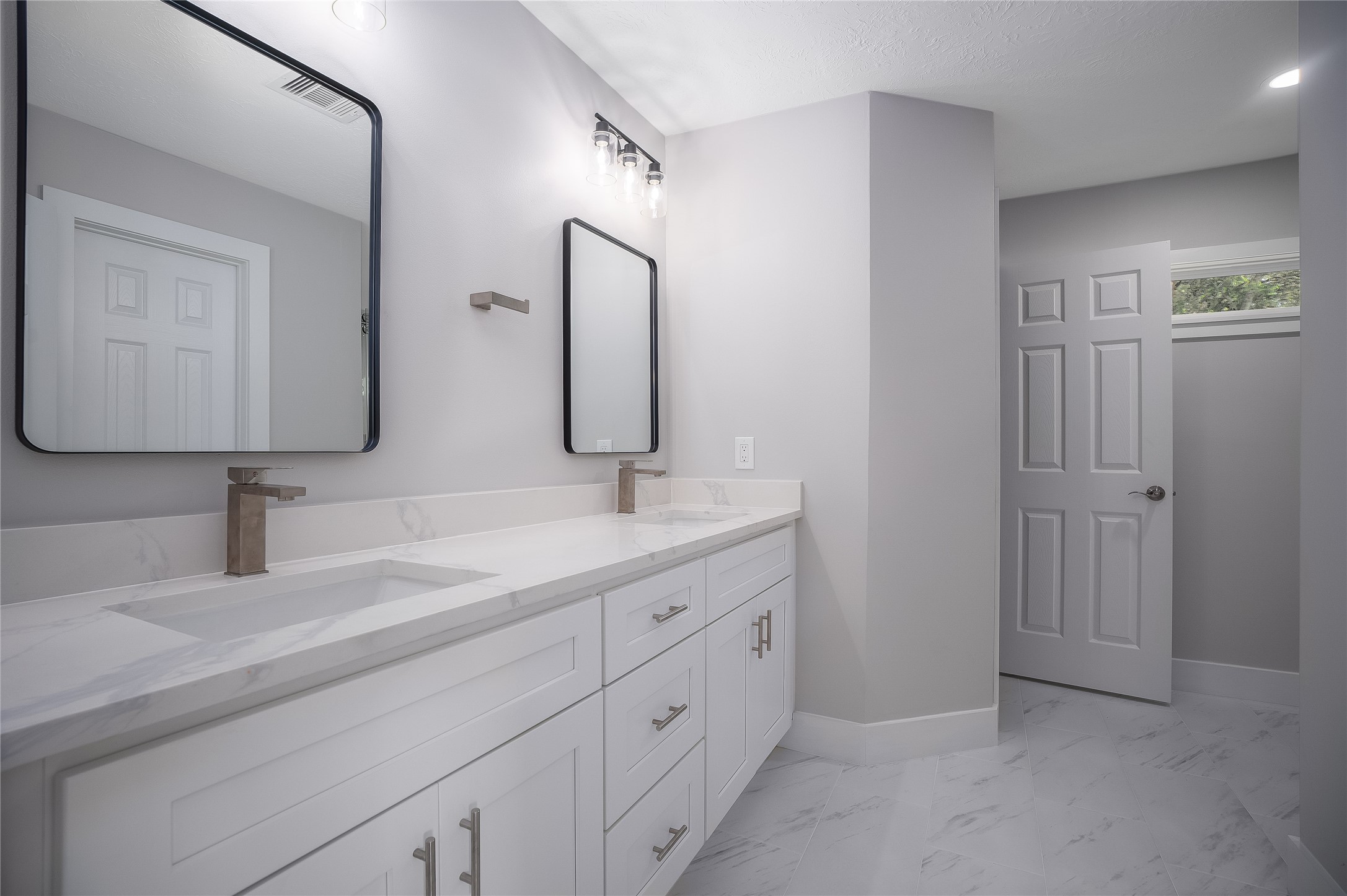 1406 Kent Way Friendswood, TX 77546 - Photo 17 of 31 a bathroom with a double vanity sink and mirror