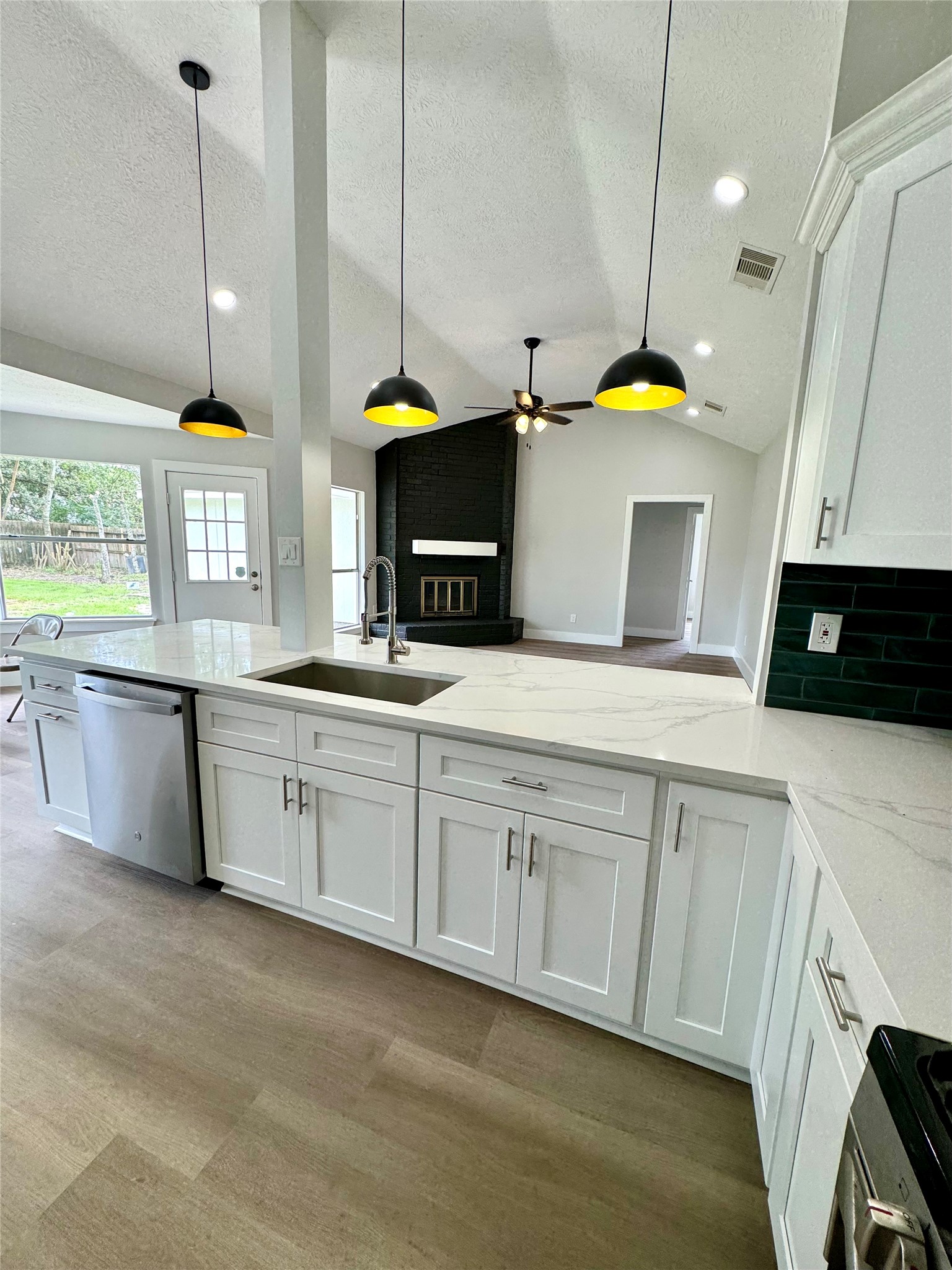 1406 Kent Way Friendswood, TX 77546 - Photo 31 of 31 a kitchen with stainless steel appliances a sink a stove and cabinets