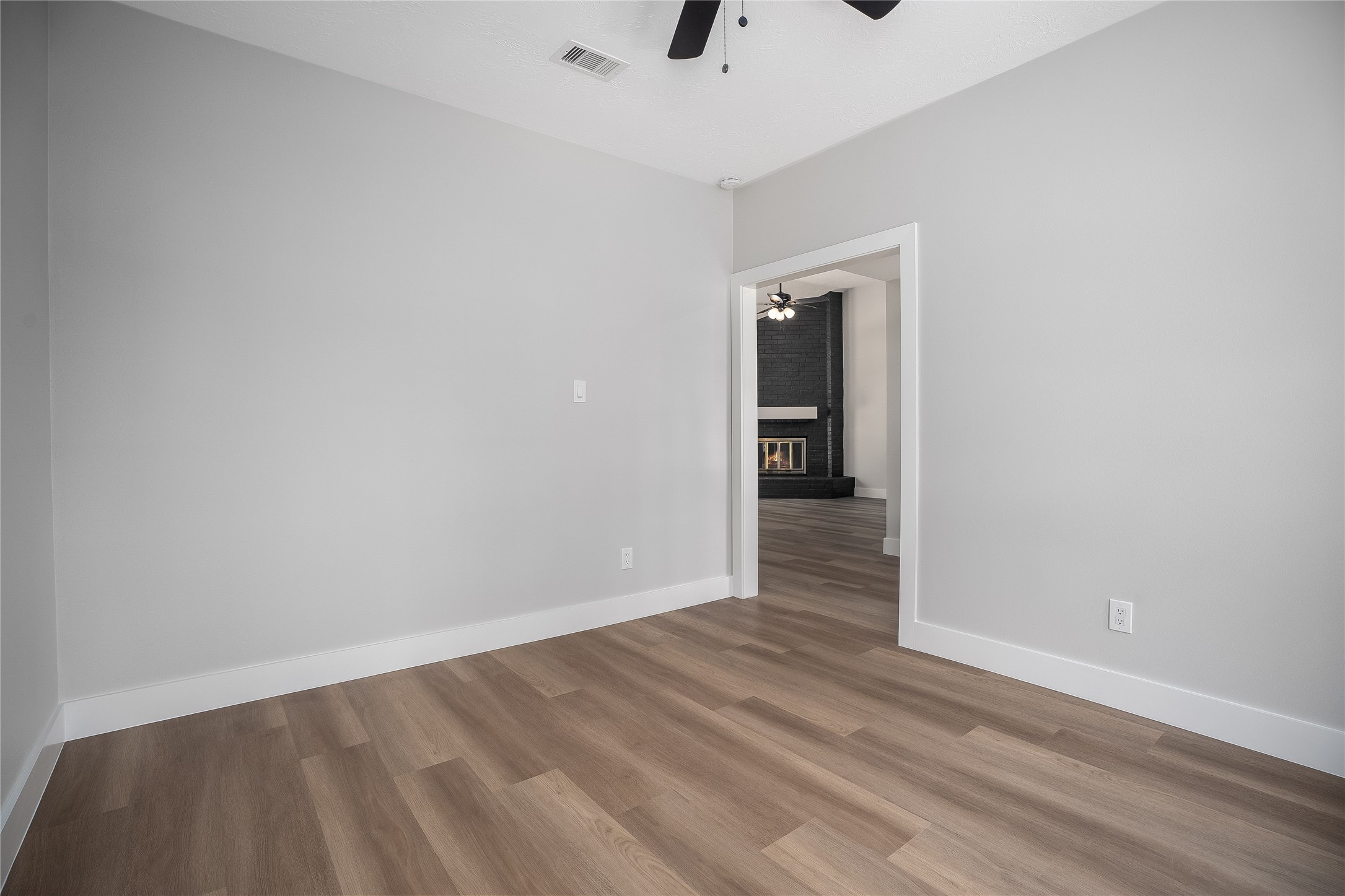 1406 Kent Way Friendswood, TX 77546 - Photo 4 of 31 a view of an empty room with wooden floor