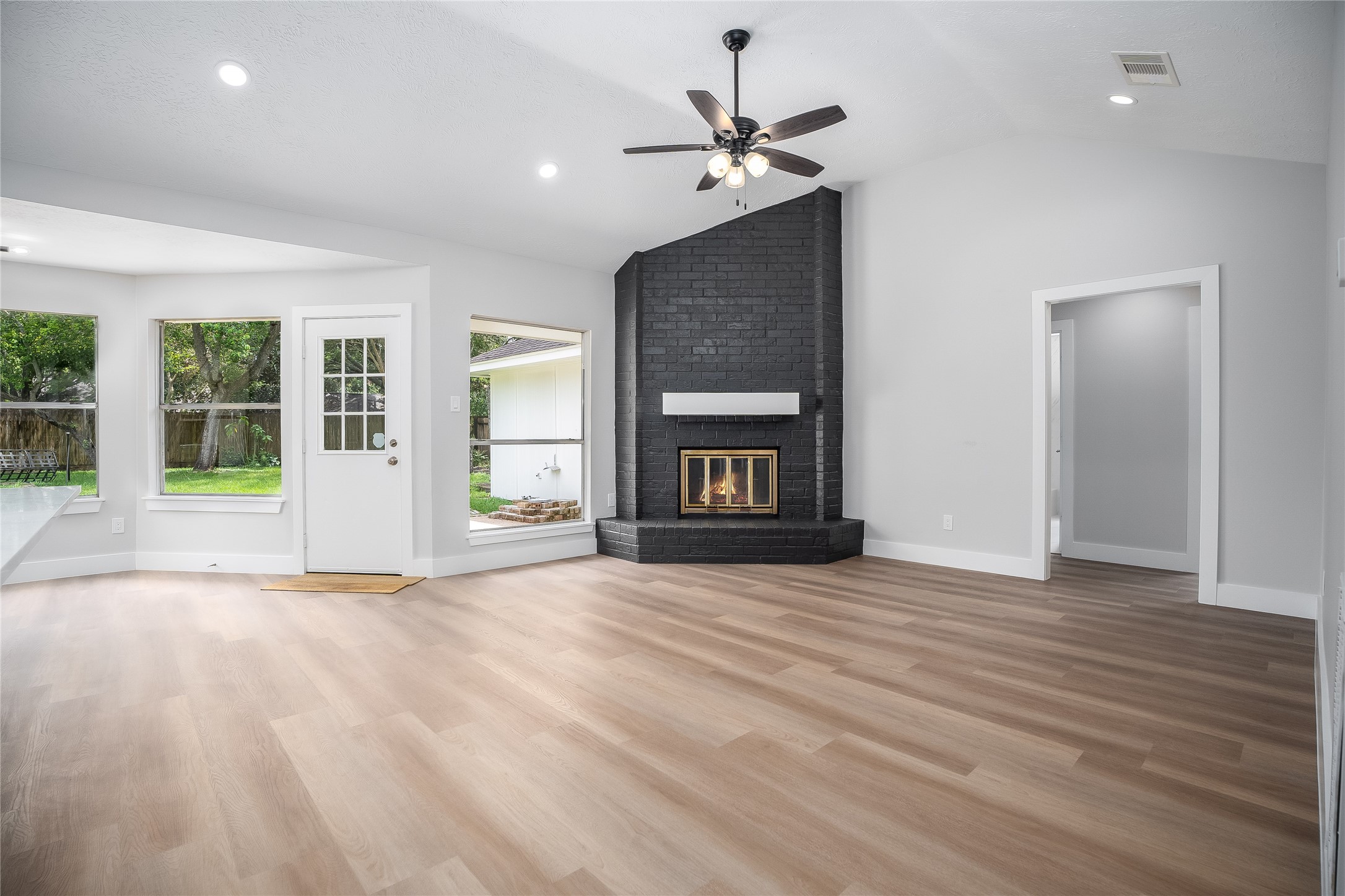 1406 Kent Way Friendswood, TX 77546 - Photo 5 of 31 a view of an empty room with window and fire place