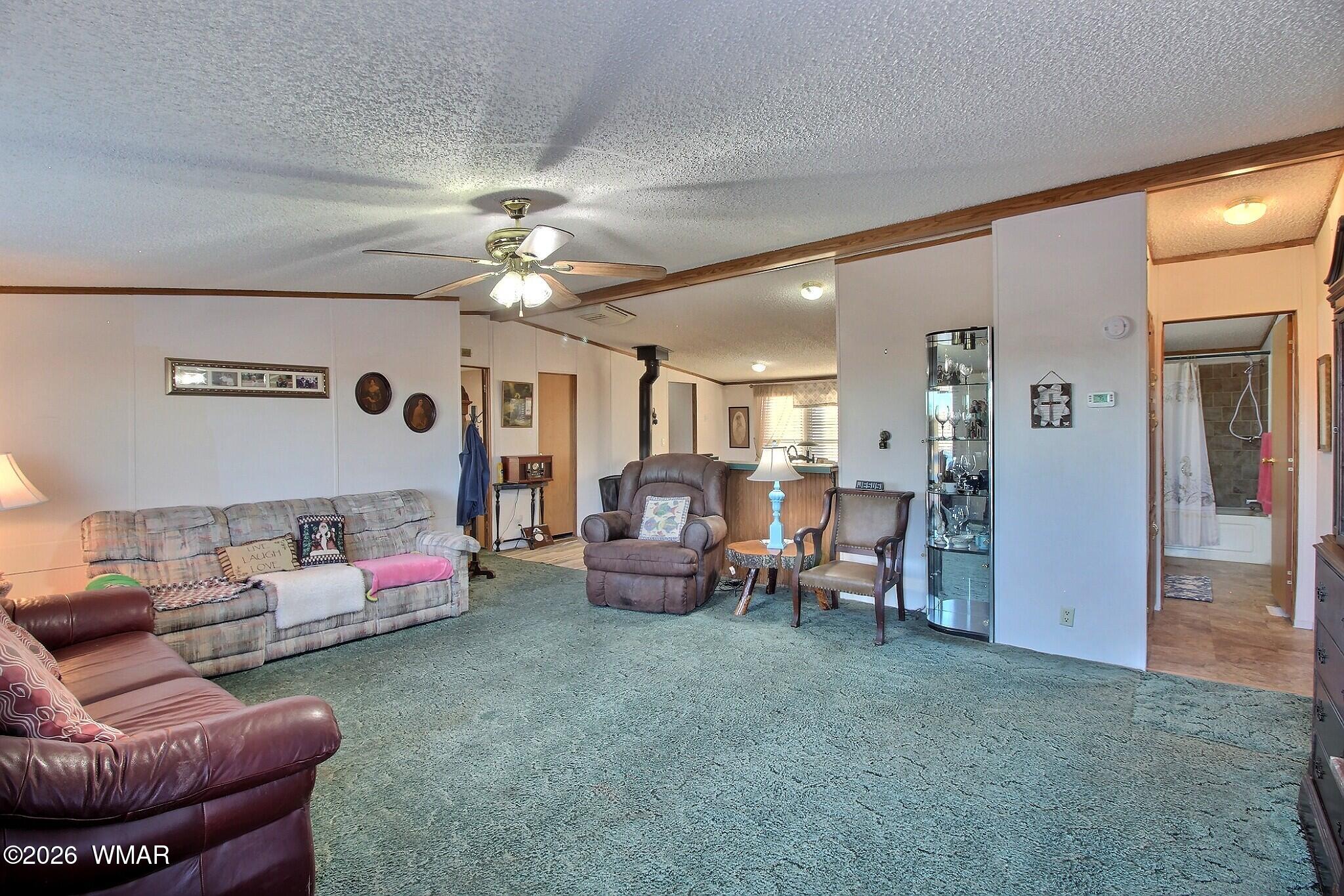 4710 Hay Hollow Road Snowflake, AZ 85937 - Photo 4 of 20 a living room with furniture and a chandelier