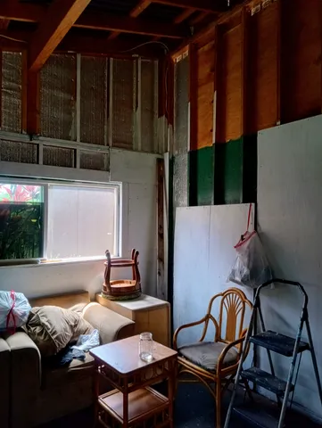 a backyard of a house with table and chairs