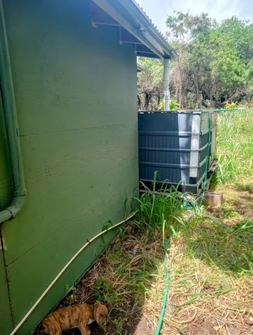 a view of a back yard from a balcony