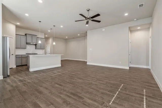 a view of a kitchen with a sink and a window