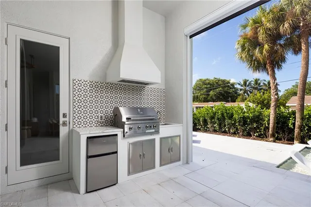 a view of kitchen with sink and stove