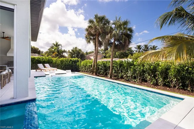 a view of swimming pool from a yard