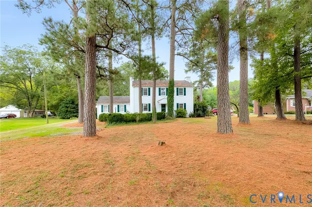 a house with trees in front of it