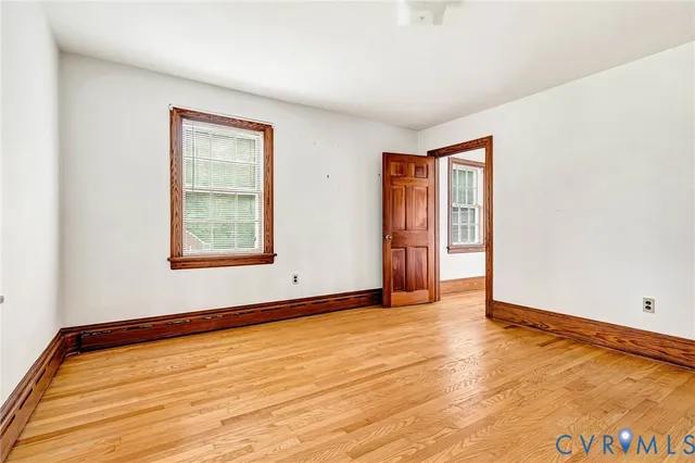 a bathroom with a double vanity sink and mirror