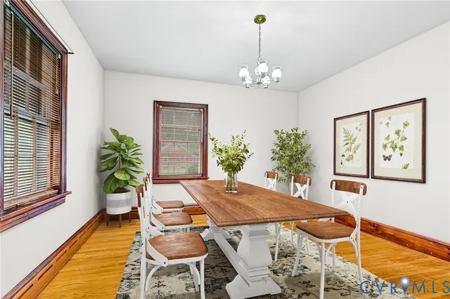 a view of a kitchen with wooden floor and cabinets