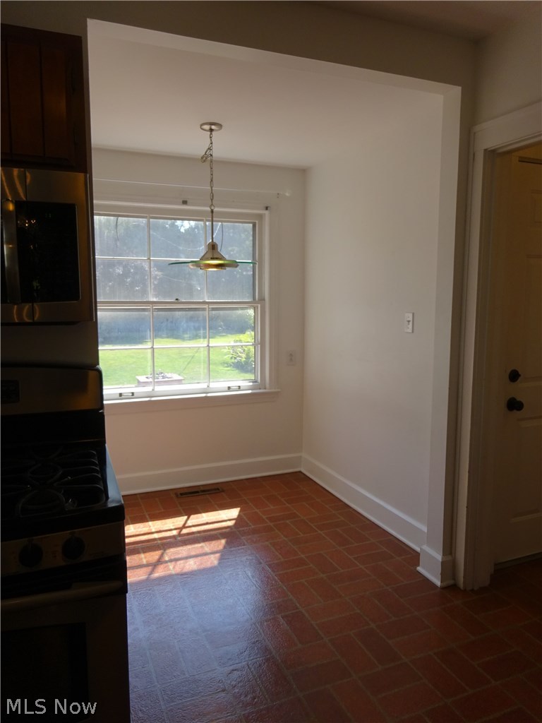 971 Roanoke Road Cleveland, OH 44121 - Photo 7 of 19 Breakfast nook has a large window overlooking the yard.