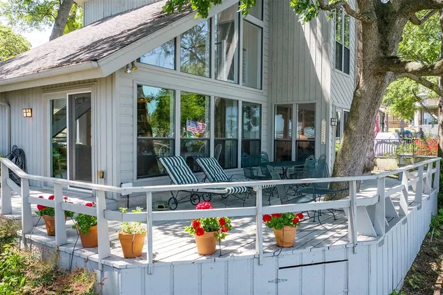 a view of house with outdoor space and sitting area