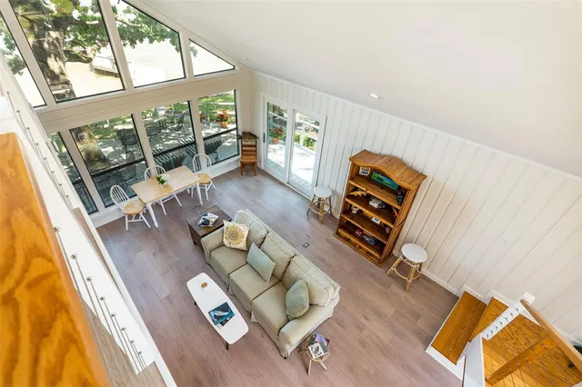 view of a living room with furniture and a floor to ceiling window