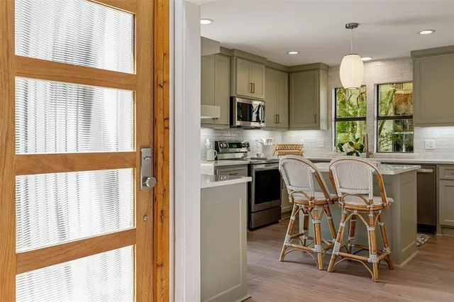 a view of a dining room with furniture window and outside view