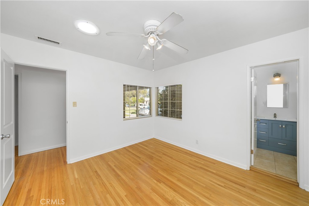 7445 Mammoth Avenue Van Nuys, CA 91405 - Photo 16 of 33 wooden floor in an empty room with a window