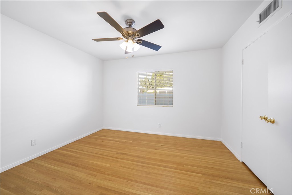 7445 Mammoth Avenue Van Nuys, CA 91405 - Photo 23 of 33 a view of a big room with wooden floor and windows