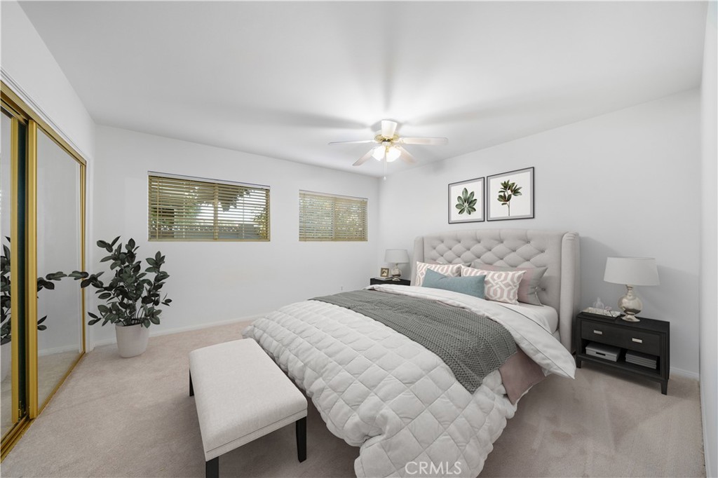 7445 Mammoth Avenue Van Nuys, CA 91405 - Photo 25 of 33 a bedroom with a bed and a chandelier