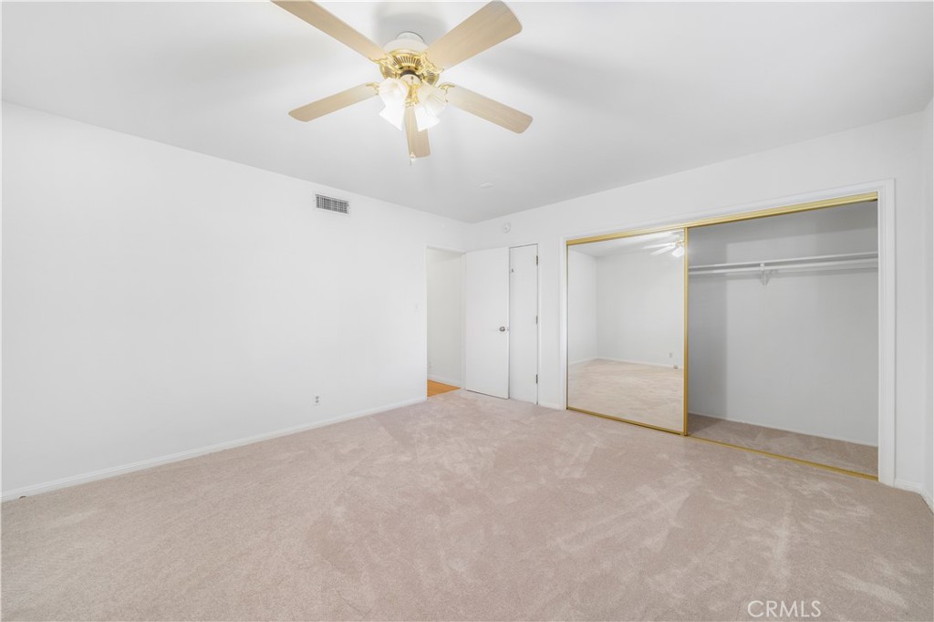 7445 Mammoth Avenue Van Nuys, CA 91405 - Photo 27 of 33 an empty room with chandelier fan