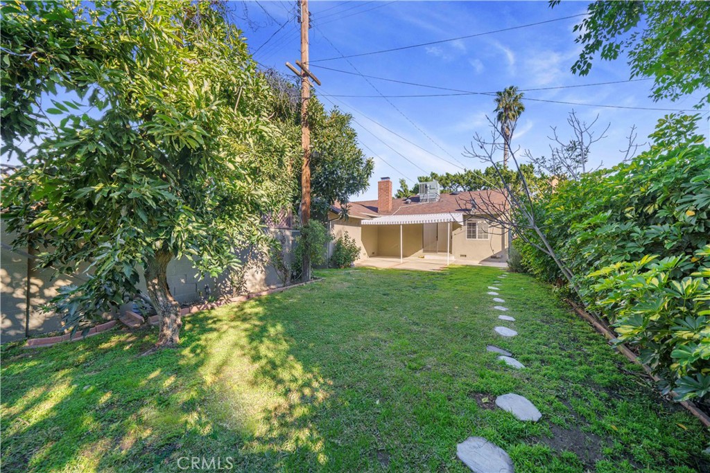 7445 Mammoth Avenue Van Nuys, CA 91405 - Photo 32 of 33 a front view of a house with a yard