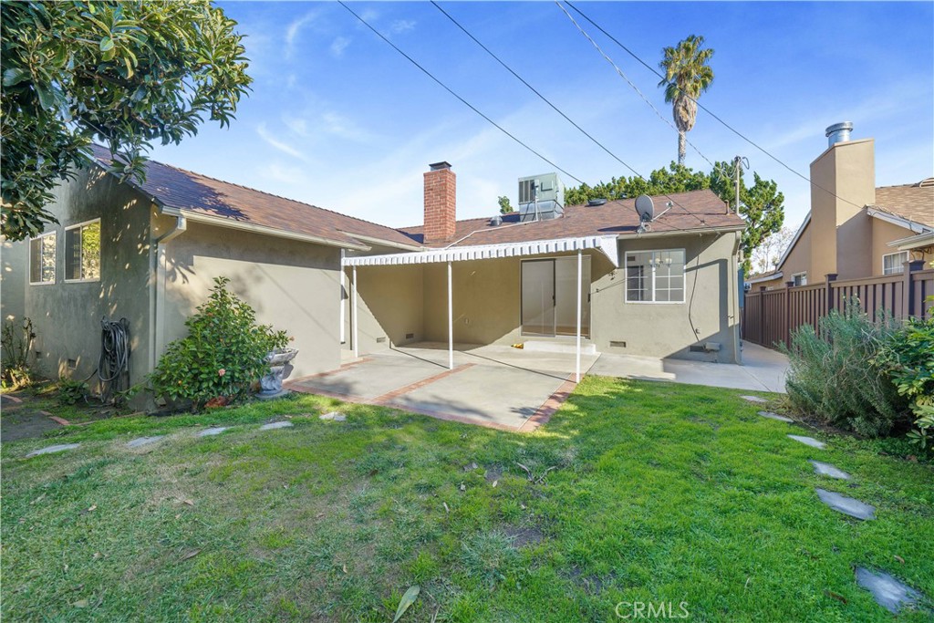 7445 Mammoth Avenue Van Nuys, CA 91405 - Photo 33 of 33 a view of a house with a yard and potted plants