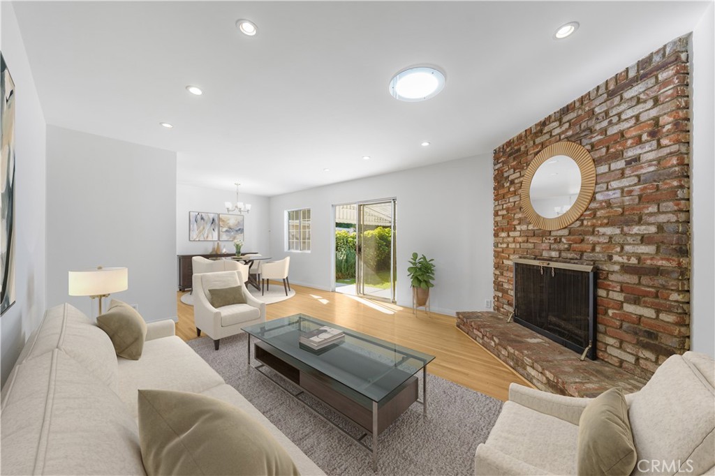 7445 Mammoth Avenue Van Nuys, CA 91405 - Photo 5 of 33 a living room with furniture and a fireplace