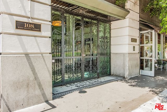 a living room filled with furniture and a large window