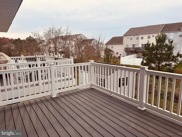 a view of a houses with wooden fence