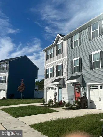 a front view of building with yard