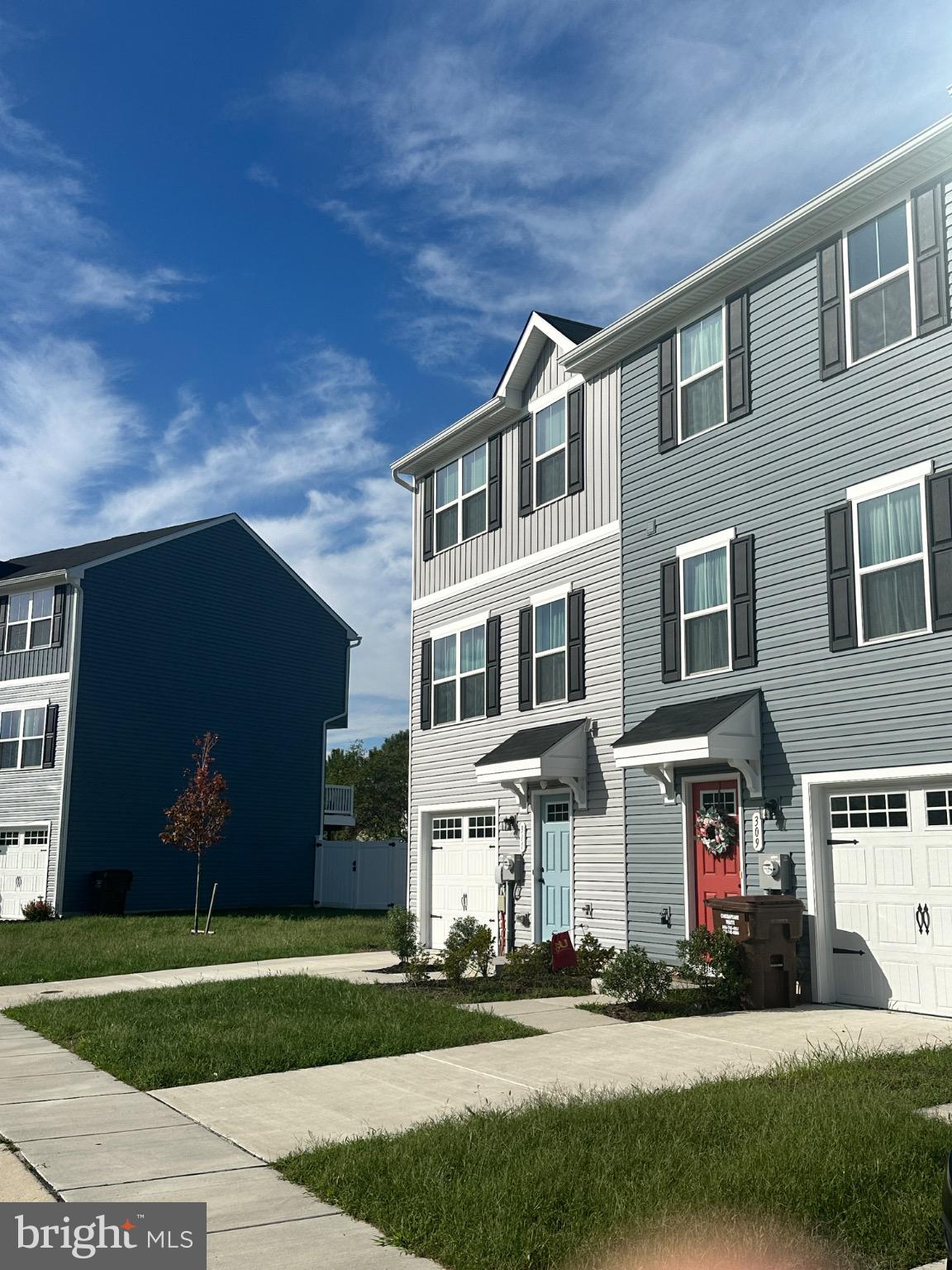 309 Yellow Bill Lane, Unit JUNIPER Cambridge, MD 21613 - Photo 5 of 25 a front view of building with yard