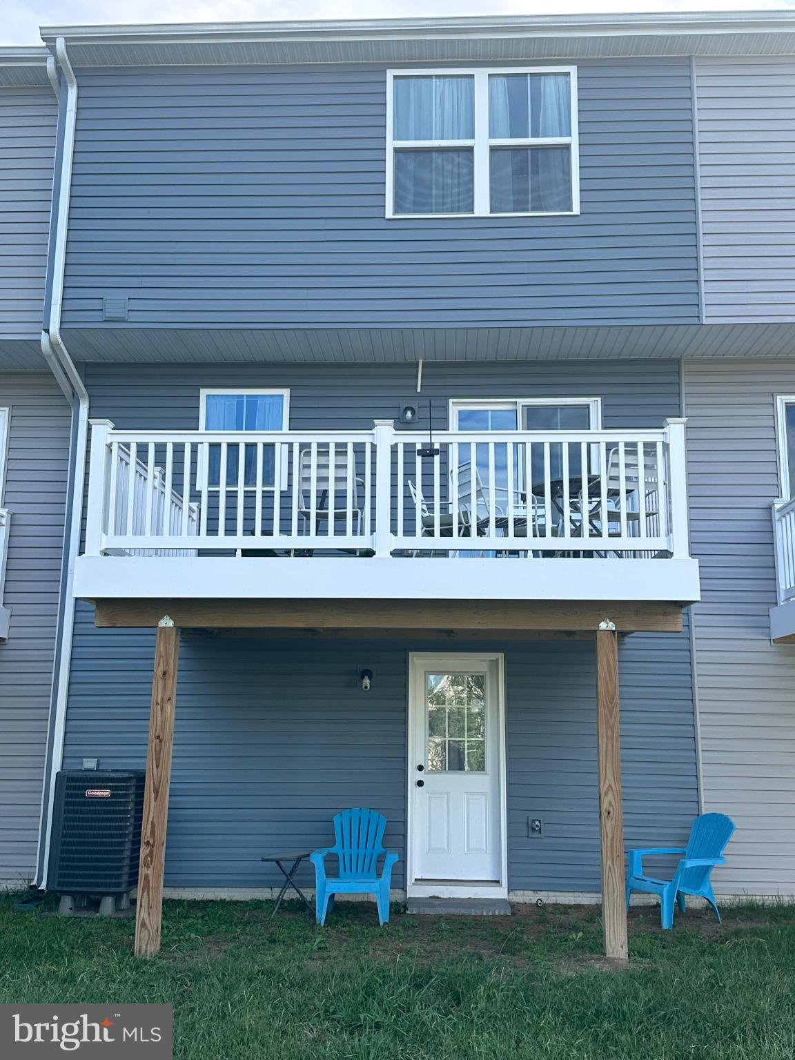 309 Yellow Bill Lane, Unit JUNIPER Cambridge, MD 21613 - Photo 6 of 25 a front view of a house with a garden and plants