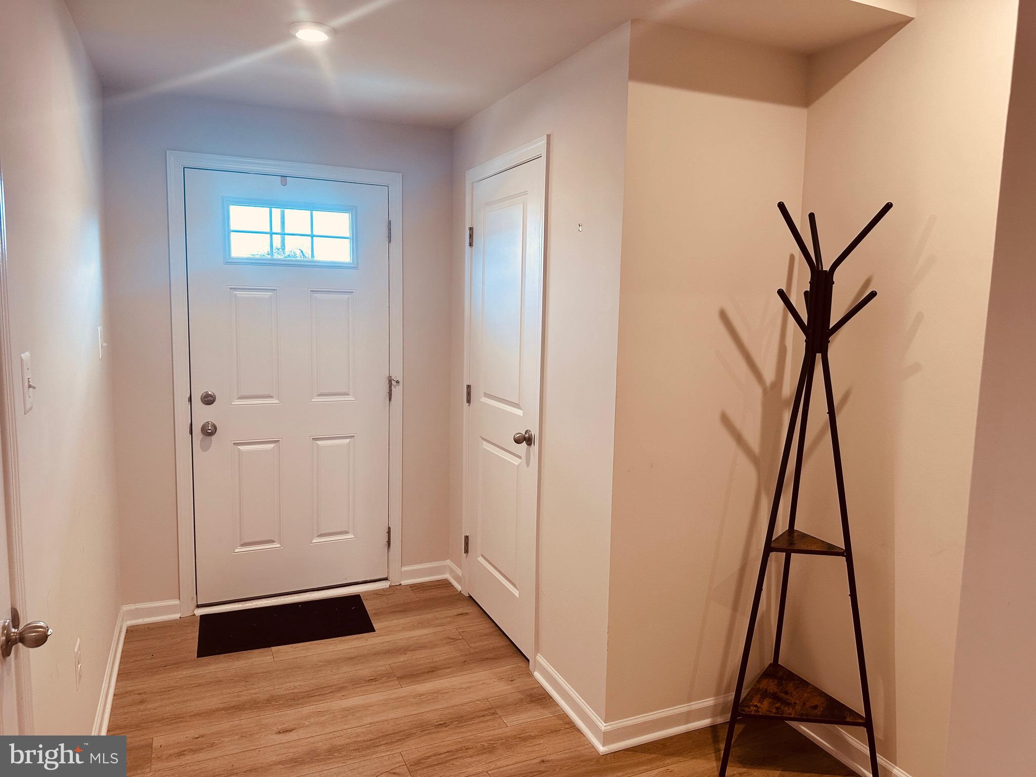 309 Yellow Bill Lane, Unit JUNIPER Cambridge, MD 21613 - Photo 7 of 25 a view of an entryway with wooden floor