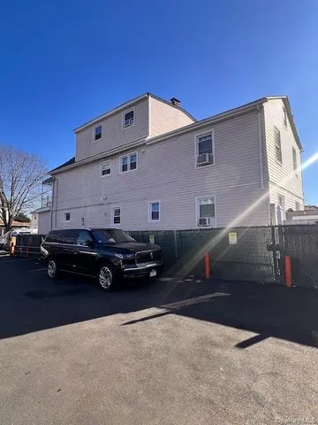 a car parked in front of a house