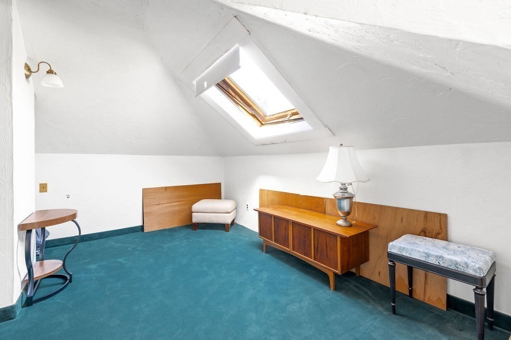 60 High Street Needham, MA 02494 - Photo 22 of 32 a room with wooden furniture and a rug