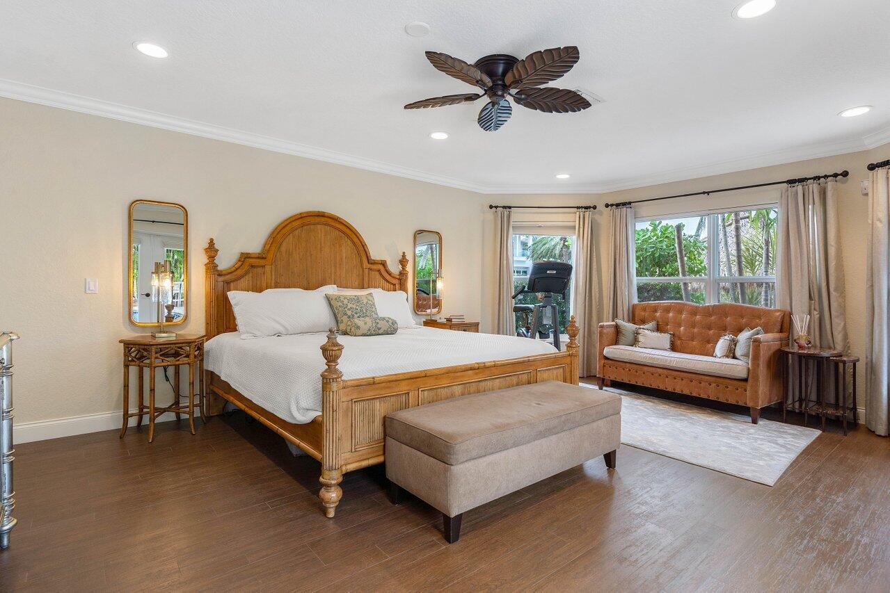 601 Phillips Drive Boca Raton, FL 33432 - Photo 19 of 56 a bedroom with a bed couch and window