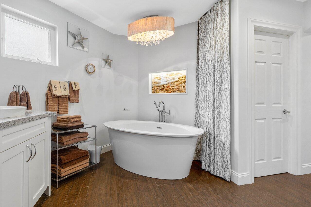 601 Phillips Drive Boca Raton, FL 33432 - Photo 22 of 56 a bathroom with a sink and a mirror