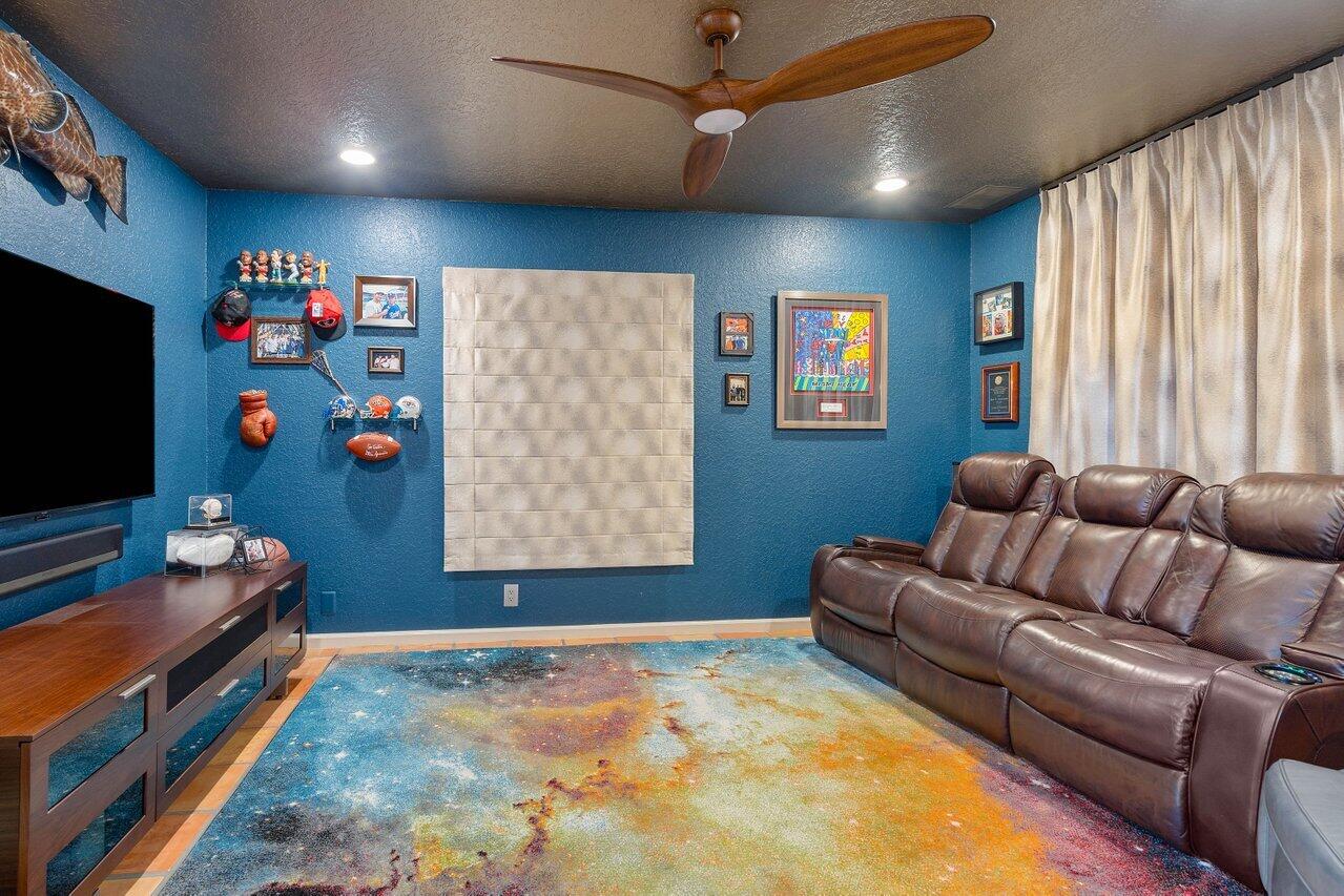 601 Phillips Drive Boca Raton, FL 33432 - Photo 29 of 56 a living room with furniture and a flat screen tv