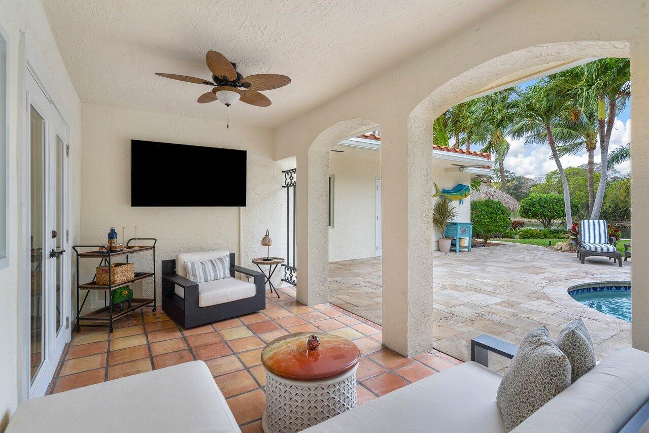601 Phillips Drive Boca Raton, FL 33432 - Photo 33 of 56 a living room with furniture and a flat screen tv