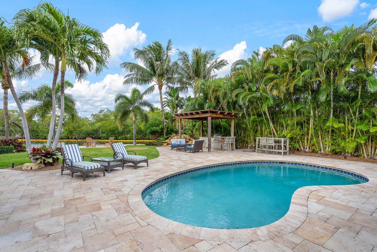 601 Phillips Drive Boca Raton, FL 33432 - Photo 34 of 56 swimming pool view with a seating space