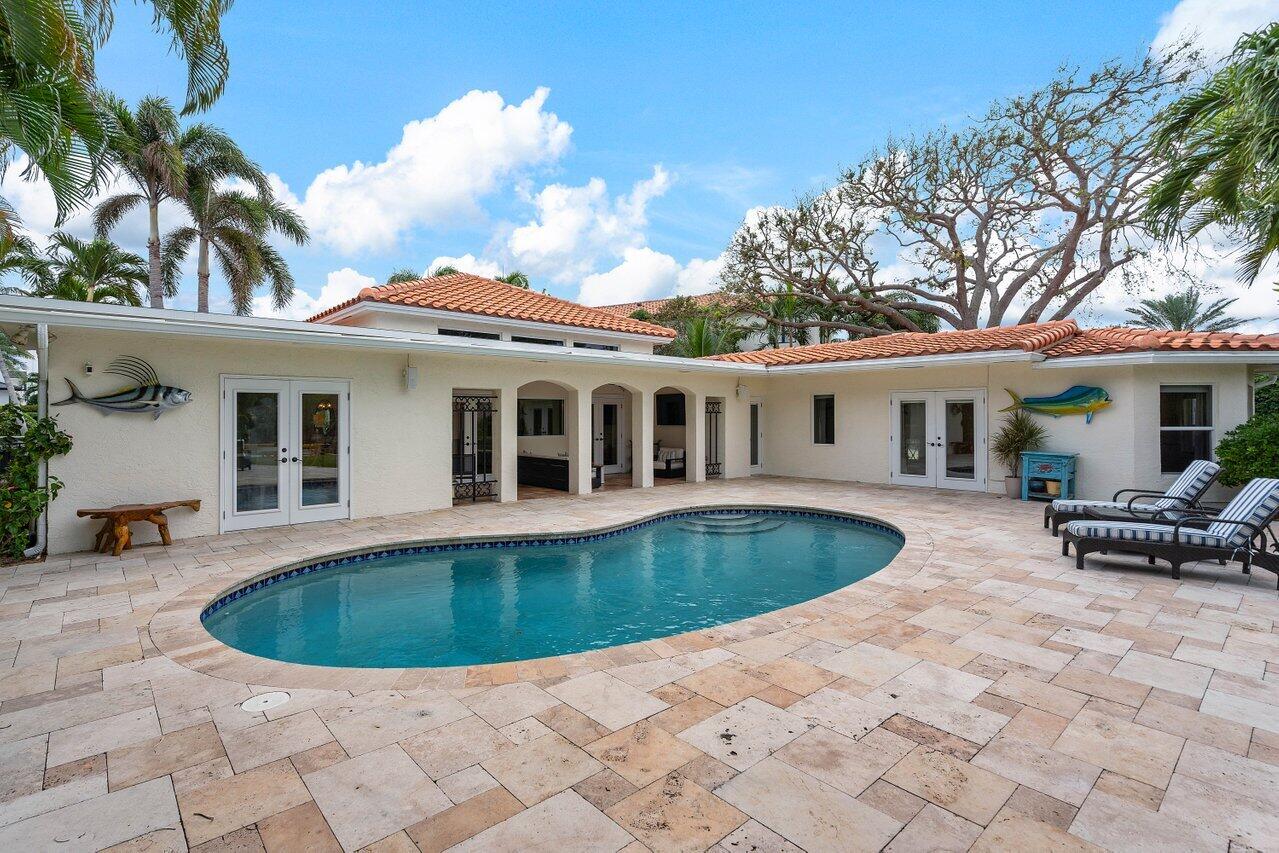 601 Phillips Drive Boca Raton, FL 33432 - Photo 36 of 56 a view of a house with swimming pool and sitting area